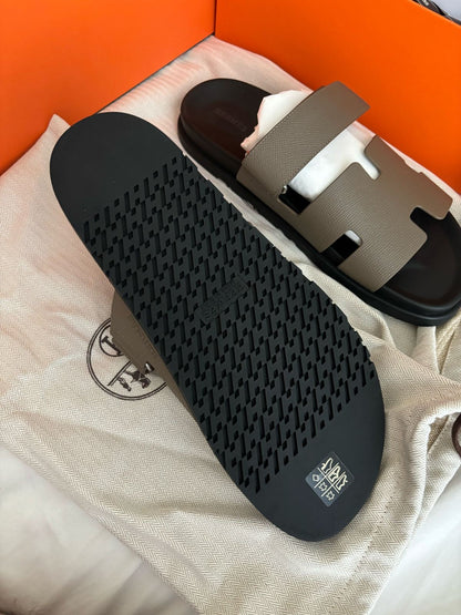 Brand New Hermès Men’s Chypre Sandals – Etoupe & Black | Luxury Leather Slides UAE