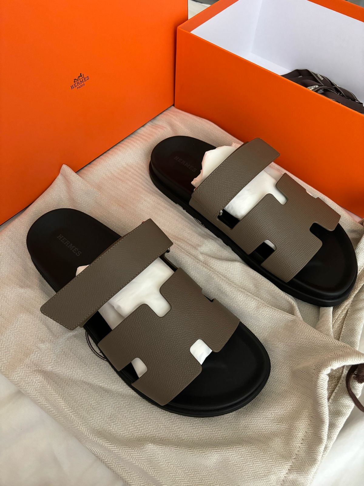 Brand New Hermès Men’s Chypre Sandals – Etoupe & Black | Luxury Leather Slides UAE